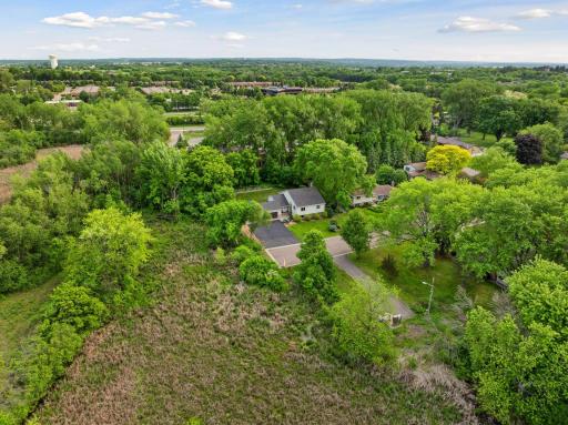 Nestled on a sprawling lot with pristine wetland views.