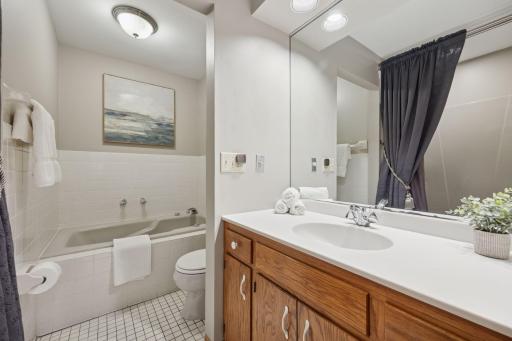 Spa like full bathroom is light and bright with soaking tub.