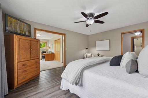 Spacious bedroom with adjoining living space perfect for a home office.