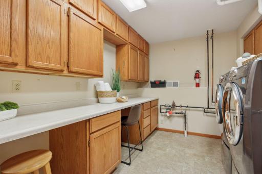 Spacious utility room is perfect for crafting or other projects.