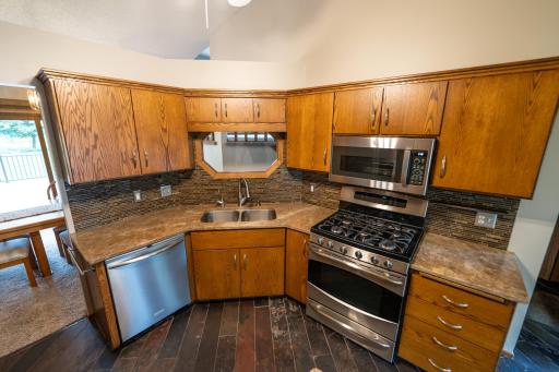 Stainless steel appliances in the kitchen, as well as washer and dryer in the laundry room stay with the home. Top quality hunter Douglas blinds throughout the home. Including roller shades, Roman shades and levered slatted shades