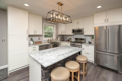 Welcome Home! Beautiful remodeled kitchen with all new white soft close cabinets and drawers.