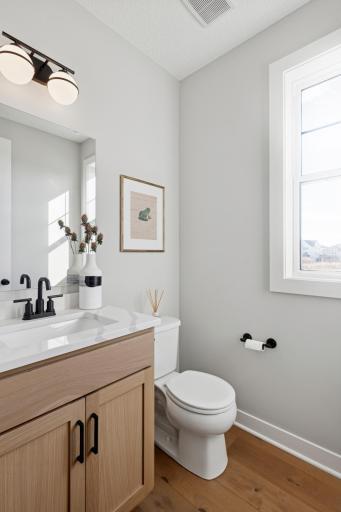 Powder bath on main level tucked away for convenience and privacy