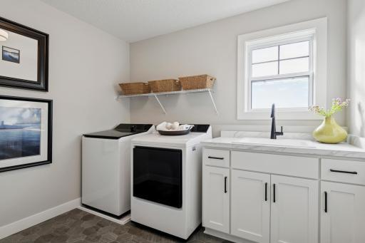 Spacious laundry room offering organization and functionality