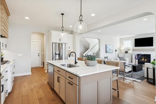 Oversized island with cabinets on both sides offering ample storage space