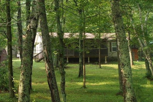 Modular home situated on the shore of Lawrence Lake on a 3.7 acre lot