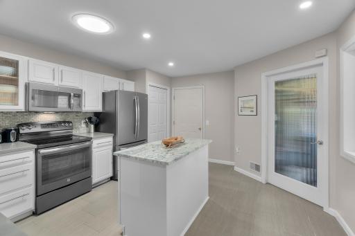 Stainless steel appliances and luxury tiled floors. Convenient access to the garage.