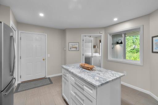 A textured glass door leads to the laundry room.