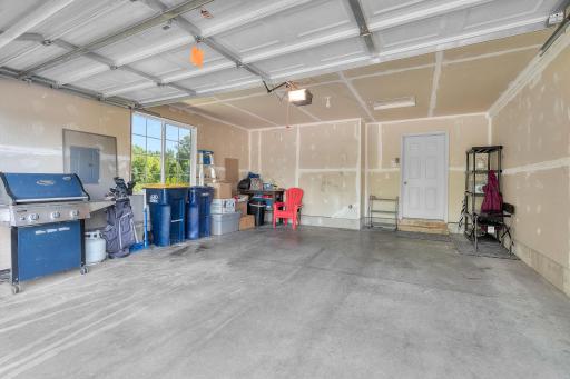 Attached two car garage with window for natural lighting.
