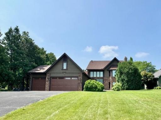 Welcome to 5795 Otter Lake Road. Wonderful landscaping and lake views!