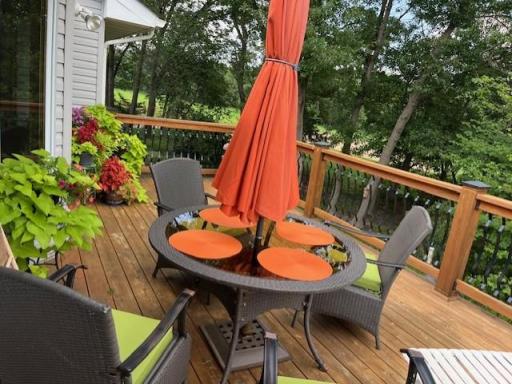 View of large deck and backyard golf course