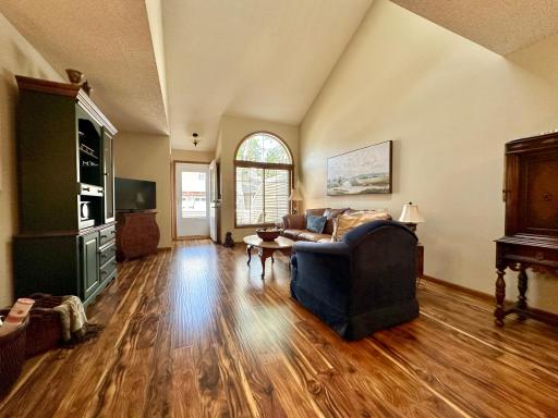 The engineered hardwood floor has a scrapped look and is very attractive.