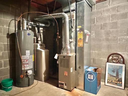 The utilities are nicely organized into the corner and don't consume a lot of space. Basement is clean and dry for great storage.