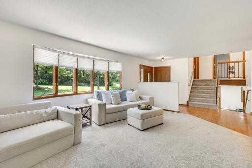 The living room's large Andersen angle bay window affords a lot of natural light to fill the room. It also offers a great view too!