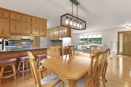 The informal dining area is centrally located and is adjacent to the home's living room, kitchen and sunroom. Such an excellent gathering place!