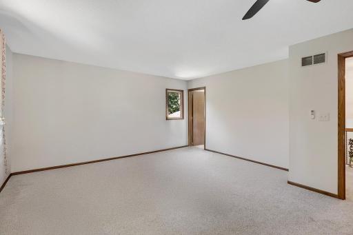 The primary bedroom is a whopping 19' x 16' in size and has its own private bathroom access. The room also features a very large closet and is also a few steps away from a large 14' x 6' walk-in closet (not shown in photo).