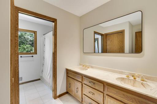 Upper level full bathroom features a private tub/shower and water closet.