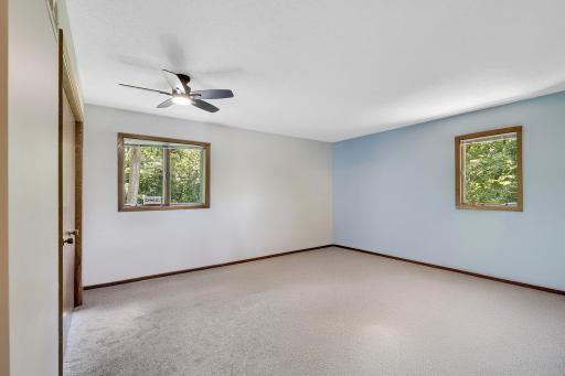 The home's 2nd bedroom is located on the upper level and is a large 16' x 14' in size, features 2 large windows and a large closet (not shown in photo).