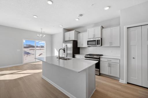 Kitchen. Photo of same floorplan NOT actual home. Selections and finishes are different.