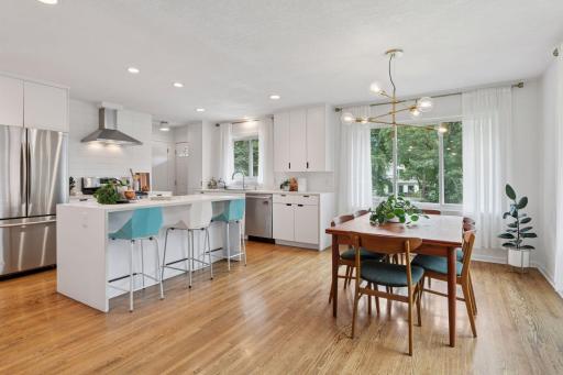 Welcome to the heart of Saint Anthony Park, at 2420 Como Avenue. Embrace privacy, airy open spaces and walkability in this midcentury brick home.