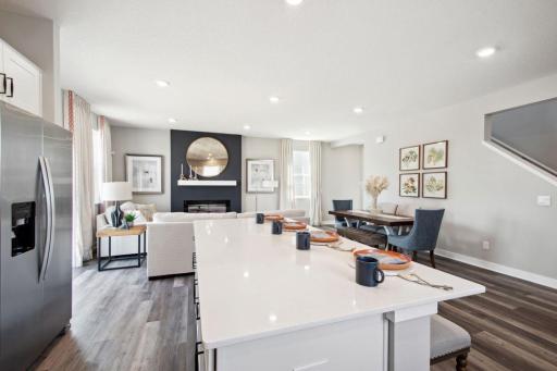 Oversized island is the perfect focal point to a kitchen that pours out into the rest of the main level living spaces!