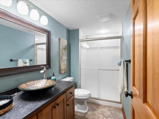 Lower level tiled shower.