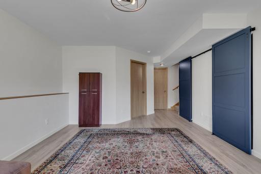 Barn Doors Open to Laundry Area and Mechanicals