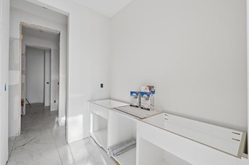 Primary bedroom bathroom with dual vanities - photo taken 3/29