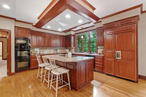 Chef-inspired kitchen with a large island, beautiful finishes and ample storage for all of your culinary needs.