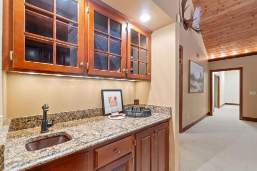 Conveniently located wet bar allows for effortless entertaining.
