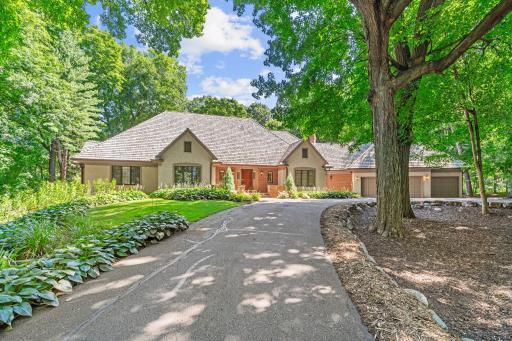 One-level estate situated on 3.5 wooded acres in prestigious North Ridge Farm neighborhood.