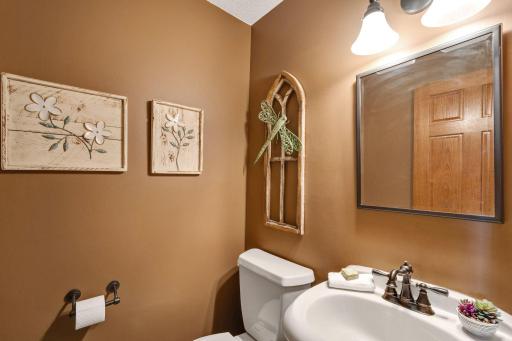 Main floor powder room between flyer and kitchen