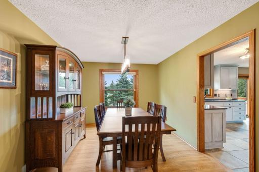The formal dining room is just off the kitchen and also features newer oak hardwood flooring. Seats 6 for everyday and there is lots of room to expand the table to comfortable seat 10.