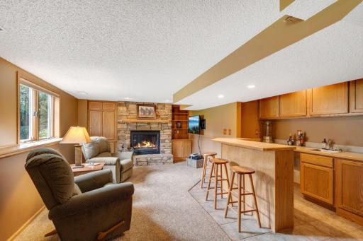 The fully finished lower level is so welcoming. Invite the crew over for GAME DAY and entertain in style with the wet bar, TV area and built in cabinets to store all your board games.