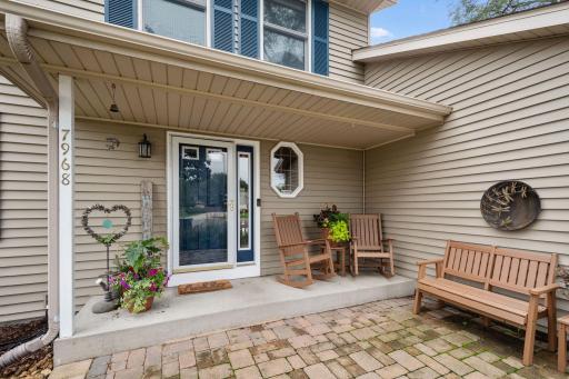 The charming gardens and paver patio greet family and friends in style. The front porch is great place to connect with neighbors.