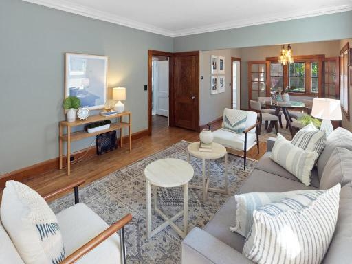 The living room leads to the main level bedroom and bathroom as well as a door to the upstairs master suite!
