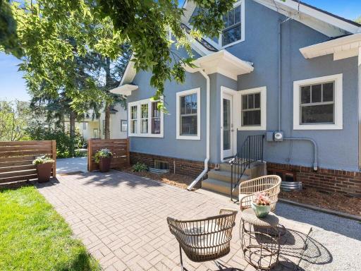 Spacious paver patio overlooks the private fenced-in back yard.