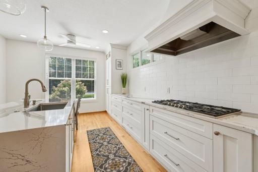 Cambria counters with built in gas cook top. Under cabinet lighting as well.