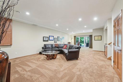 View of lower level with walk out to a private patio space.