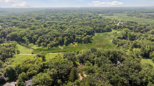 Aerial view reveals the homeâs prime location backing to Purgatory Park, with serene creek views and direct access to scenic trails