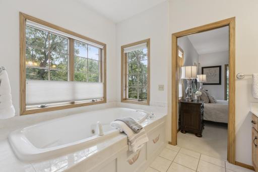 The jetted soaking tub offers views out towards Lake Pulaski while still maintaining privacy. This custom built home was very well thought out and has been extremely well maintained.