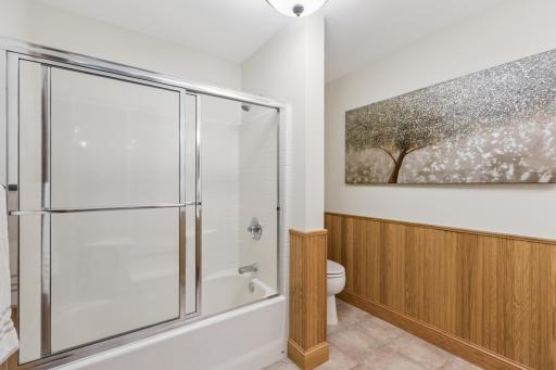The lower level features a full bath with in-floor heat and tile floors.