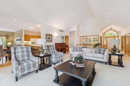 The open design of this home is accentuated by the vaulted ceilings and oversized windows lakeside. This floorplan will allow everyone to spend time together while still having their own space.