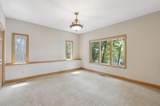 Once again this bedroom like many rooms in the home feature oversized picture windows looking out towards the lake. This bedroom is 13x13 with a double closet.