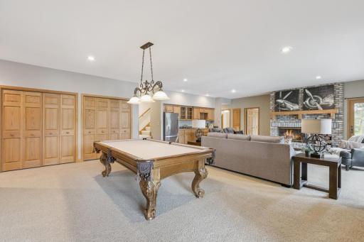 The walk-out lower level provides an open space for entertaining or relaxing along with a wet bar and plenty of storage space both in the double closets as well as storage room and workshop.