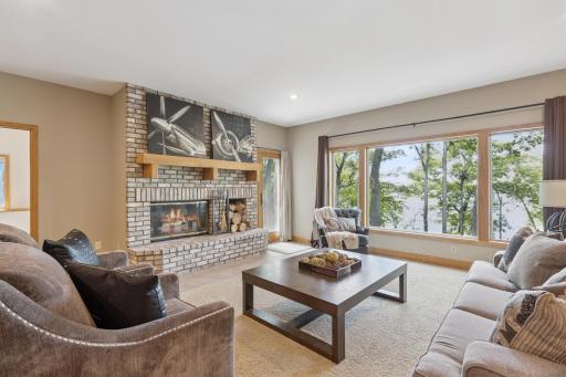 With two patio doors leading you lakeside to the paver patio that wraps around the house to underneath the deck. There are so many great spaces throughout this property all designed with the lake in mind.