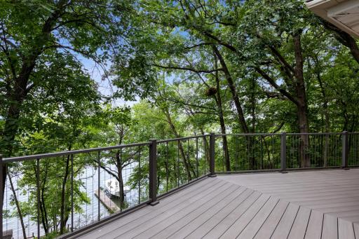 The spacious lakeside deck is maintenance free with composite decking and metal railings that were designed to not interfere with the view as you enjoy the sunset views over Lake Pulaski. Perfect for relaxing or enjoying a meal lakeside.