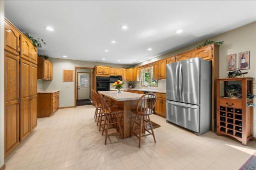 The kitchen features a center island, ample cabinet and counter space, and a dining area perfect for everyday meals or entertaining.