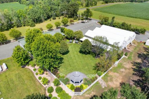 With multiple outbuildings, extensive infrastructure including 7 hydrants and 10 water access points, dedicated event parking, and room to expand, this is a one-of-a-kind estate and business opportunity!