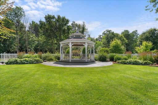 Outside, guests are greeted by lush gardens, serene fountains, a covered patio with additional seating, an open-air ceremony space with a gorgeous octagon gazebo, and a large, irrigated lawnâperfect for seamless indoor-outdoor events.